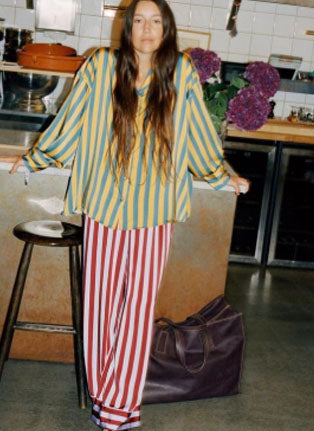 Purple top green pants